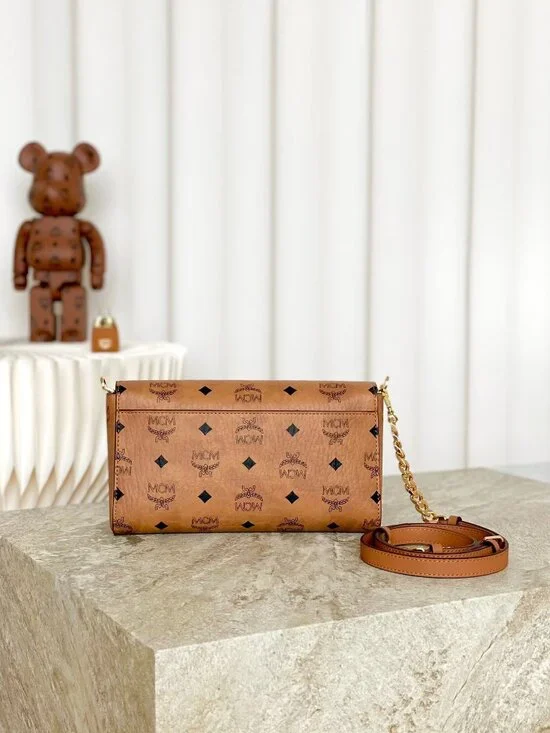 MCM Tan Monogram Clutch with Gold Accent - Picture 4 of 9